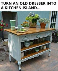 a kitchen island with pots and pans on it in front of a blue building