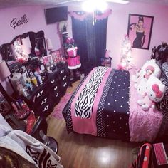 a bedroom decorated in pink, black and white