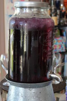 a large jar filled with liquid sitting on top of a table