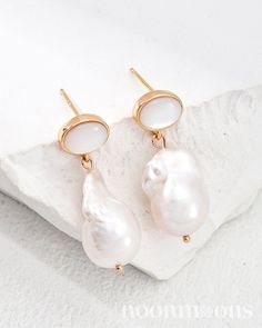 Discover the perfect blend of elegance and natural beauty with our Irregular Pearl Stud Drop Earrings. These stunning pieces feature charming shell studs that gracefully lead to a large, irregular baroque mother of pearl drop, each showcasing its unique shape and lustrous finish. Crafted with care in 18k gold-plated sterling silver, these earrings radiate sophistication while adding a touch of organic flair to any outfit. Whether for a casual day out or a glamorous evening event, these earrings Natural Pearl Earrings, Natural Aesthetic, Silver Pearl Earrings, Natural Pearl, Pearl Shell, Moon Earrings, Pearl Size, Pearl Studs, Pearl Drop Earrings