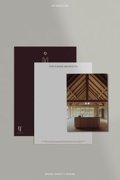 two brochures with an image of a kitchen and dining room in the background