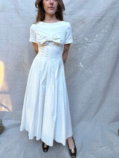 "Incredible 1950s Handmade White Velvet Dress / Big Bow at Bust / Center Back Zipper / Unlined which leaves room for letting out the waist seams if needed / Very Special One of a Kind / Perfect for Bridal / Full Sweep ! Measurements: Size XS - can be let out by tailor LAID FLAT Waist: 25\" Chest: 32\" Front Length from HPS: 48\" Shoulder: 13 1/2\" Sleeve Length: 7 1/8\" Sweep: 164\"  100% Velvet Condition:  Great vintage condition.  ** ALL SALES ARE FINAL , ask for detailed photos if needed **" White 50s Dress, White Velvet Dress, Vintage White Dress, Debutante Dresses, Holiday Party Fashion, White Vintage Dress, Wardrobe Architect, Bias Cut Dress, White Velvet