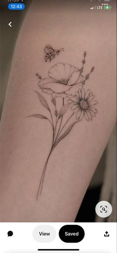 a tattoo with flowers on the arm and a butterfly sitting on top of one flower