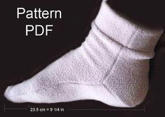 a pair of white socks sitting on top of a black background with the words pattern pdf