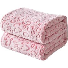 two pink leopard print blankets stacked on top of each other in front of a white background