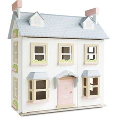 a doll house with pink door and windows