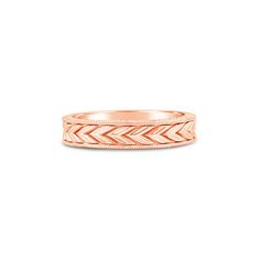 a rose gold wedding band with an intricate design