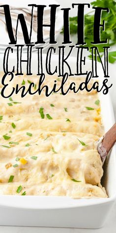 white chicken enchiladas in a casserole dish with a wooden spoon