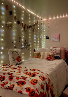 a bedroom decorated with halloween decorations and lights