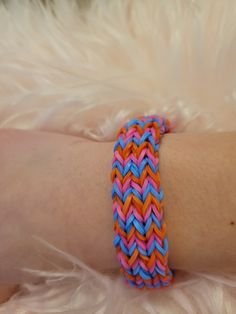 a person's arm with a colorful bracelet on it