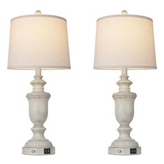 two white lamps sitting next to each other