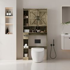 a white toilet sitting next to a wooden cabinet