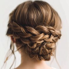 Stay on trend with updos featuring a braided low bun. Perfect for a modern look. Save this pin for trendy hairstyle ideas! #BraidedLowBun #Updo #BlackWomen #TrendyStyle Bridal Low Bun With Braid, Low Bun For Black Women, Bun For Black Women, Low Braided Bun, Braided Low Bun, Updo With Braid, Fairy Court, Wedding Bun, 90s Prom