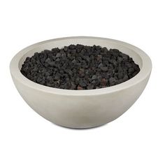 a white bowl filled with black gravel