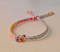 a colorful bracelet with a knot on it