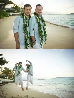 two men in blue shirts and white pants on the beach with leis around their necks