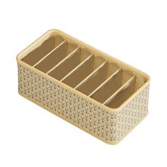 a brown and white basket with six compartments on the bottom, in front of a white background