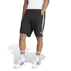 Three stripes for the win! In the adidas 3-Stripe Men's Shorts, you'll be repping your brand with these shorts that are so obviously adidas with their three-stripes. The elastic waistband means they'll stay up well but doesn't require you to be uncomfortable with a button or tight fit. These are ideal for on and off the court and are easy to match with a tee or even a hoodie (if you're into that look in the winter).Features: Features three stripes down side. Has adidas logo on the leg. Elastic w Be Uncomfortable, Soccer Shop, White Kicks, Wide Width Shoes, Backpack Sport, Stay Up, Short Jacket, Striped Shorts, Adidas Logo