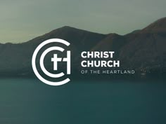 the logo for christ church of the heart and soul, with mountains in the background