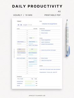 the daily planner is displayed on top of a white table with a blue marker next to it