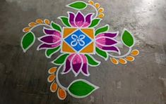 a colorful flower design on the ground