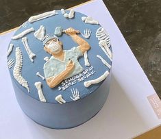 there is a blue cake with an image of a man holding a baseball bat on it