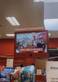 a television that is sitting on top of a stand in a store with other items