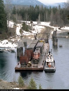 two boats in the water next to a dock