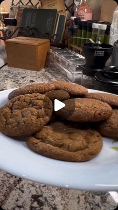 a plate full of cookies sitting on top of a counter