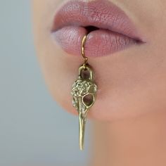 Turn heads in this one of a kind ancient Egyptian Thoth inspired lip cuff. Get the look without the commitment, no piercing is needed for this style. These Faux lip rings are made with thick tarnish resistant copper wire. Available in brilliant gold, sterling silver, or a natural bronze color.  This face jewelry does not hinder the ability to speak or drink.  Comfortable and adjustable.  Tarnish resistant wire.  Perfect statement piece for summer vacation or birthday gifts. Unusual Face Piercings, Custom Piercing, Egyptian Thoth, Maximalist Minimalist, Lip Cuffs, Fake Lip Ring, Lip Jewelry, Face Jewelry, Lip Rings