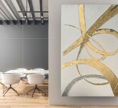 an abstract painting on the wall next to a dining room table with white chairs and tables