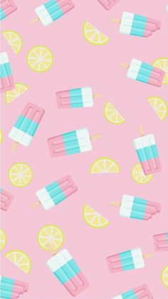 popsicles and lemons on a pink background