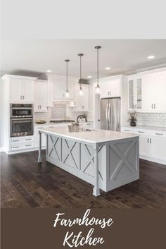 a large kitchen with an island and chandelier hanging from it's ceiling