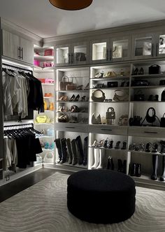 the closet is full of shoes and handbags