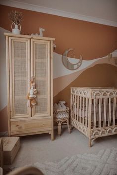 a baby's room with two cribs and a dresser in the corner