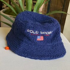 Polo Ralph Lauren Men’s Polo Sport Logo Fleece Bucket Hat Blue Size S/M Come With String But Can Be Taken Off Easily.Unisex Casual Sports Hat For Winter, Casual Winter Sports Hat, Blue Bucket Hat For Outdoor, Casual Blue Bucket Hat One Size, Navy Bucket Hat With Short Brim, Navy Casual Bucket Hat With Short Brim, Casual Navy Bucket Hat With Short Brim, Casual Cold Weather Hats With Fleece Lining, Navy Curved Brim Hat For Winter