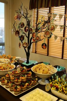 a buffet table filled with lots of different types of food and desserts on it