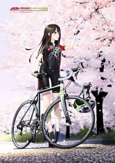 a woman standing next to a bike in front of a tree with pink flowers on it