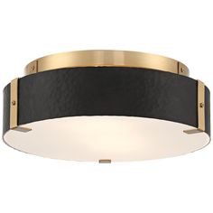 a black and gold flush light fixture