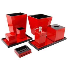 red bathroom accessories set on white background with clipping for the tissue dispenser