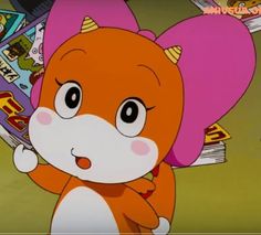 an orange and white animal holding a book in its paws with other cartoon characters behind it