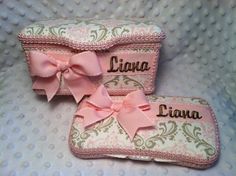 two pink purses with bows and name tags on the front one is personalized