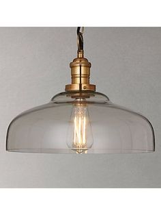 an image of a light fixture hanging from the ceiling with clear glass shades on it