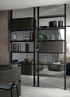 a living room filled with lots of furniture and bookshelves next to a window