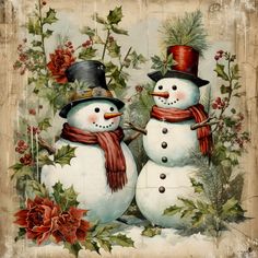 two snowmen wearing hats and scarves are standing next to each other