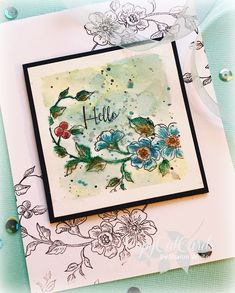 a close up of a card with flowers on it and the words hello written in cursive writing