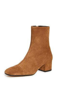 PRICES MAY VARY. Leather sole with rubber heel cap Heel: 1.75in / 45mm Leather lining Casual Square toe Simple, sleek, and versatile these STAUD booties are a must-have pair of ankle boots crafted in rich, earth-tone suede. Equally appropriate for pairing with dresses or denim, they're bound to be a new go-to for fall. Effortless Fall Outfits, How To Wear Ankle Boots, Statement Sandals, Heel Caps, Boots Fall, Rubber Heels, Short Boots, Mid Calf, Wedge Boot