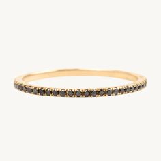 a gold band with black diamonds