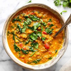 a bowl filled with soup and garnished with cilantro