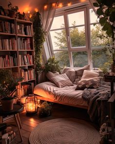 a room with a bed, bookshelf and plants in it is lit by candles